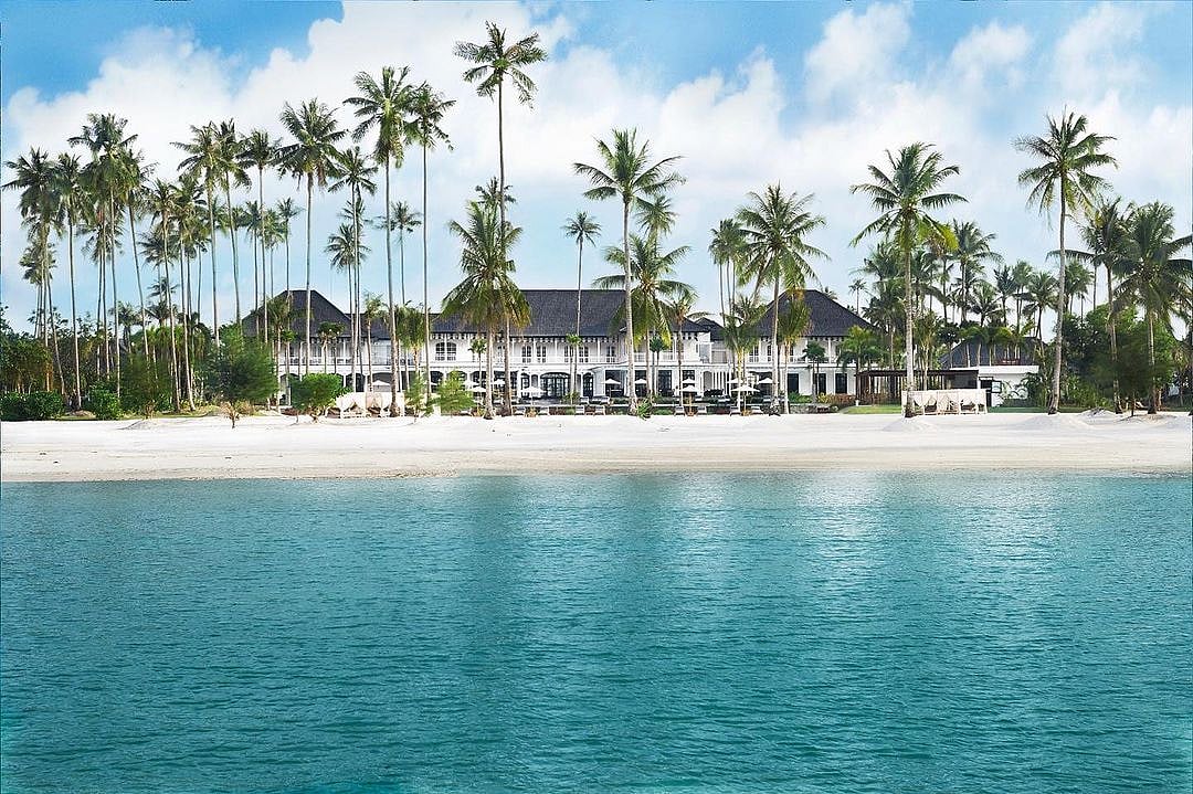A private Estate, set in expansive tropical gardens - right on the beach