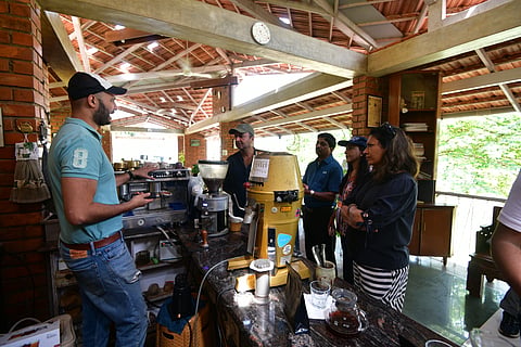 Devaya behind his coffee counter for the coffee sampling session
