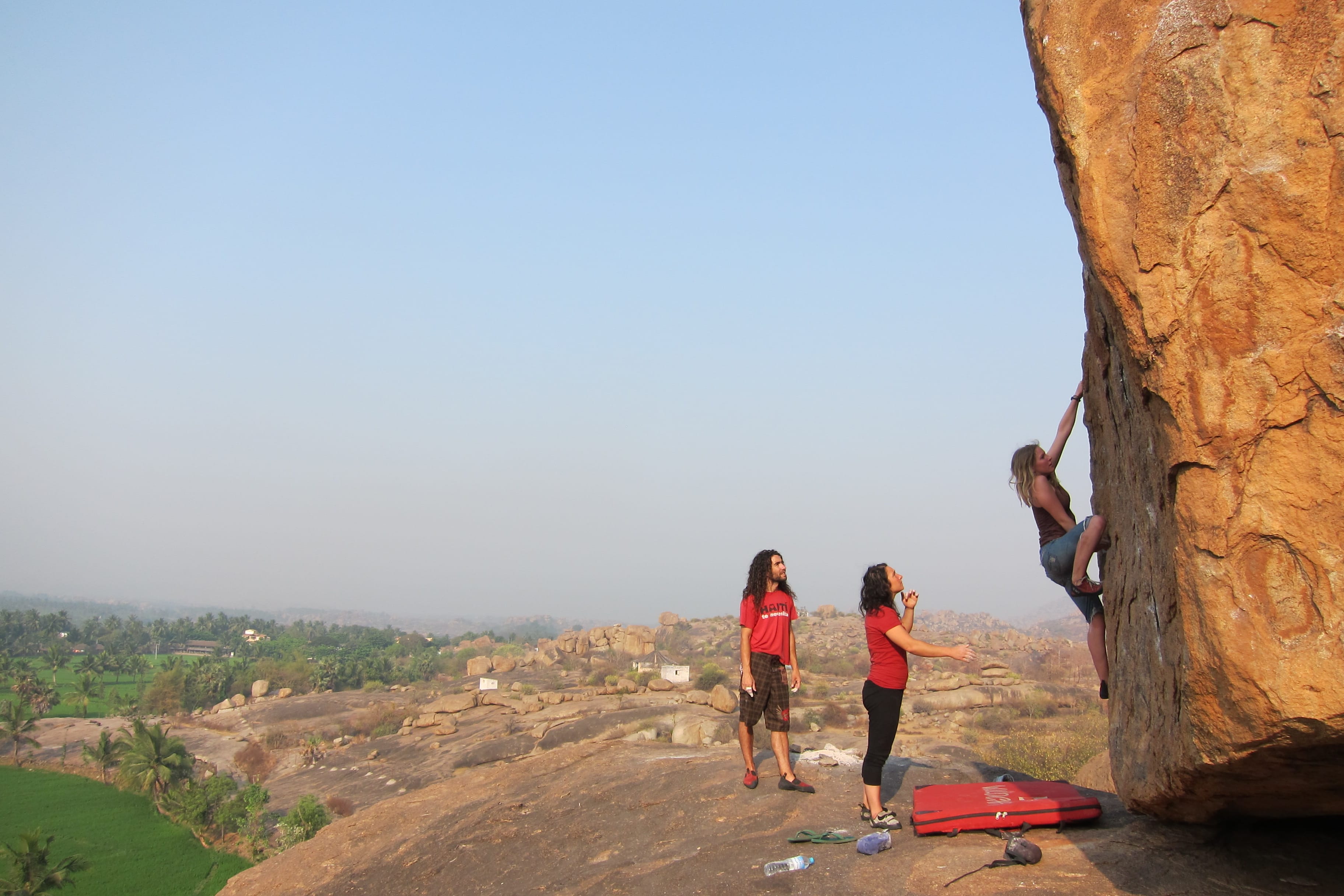 Climbing a boulder in Hampi, Karnataka