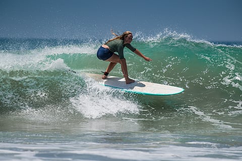 A surfer in Varkala, India