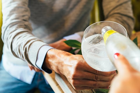 A man being poured gin