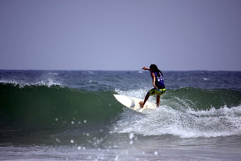Surfing at Kovalam beach