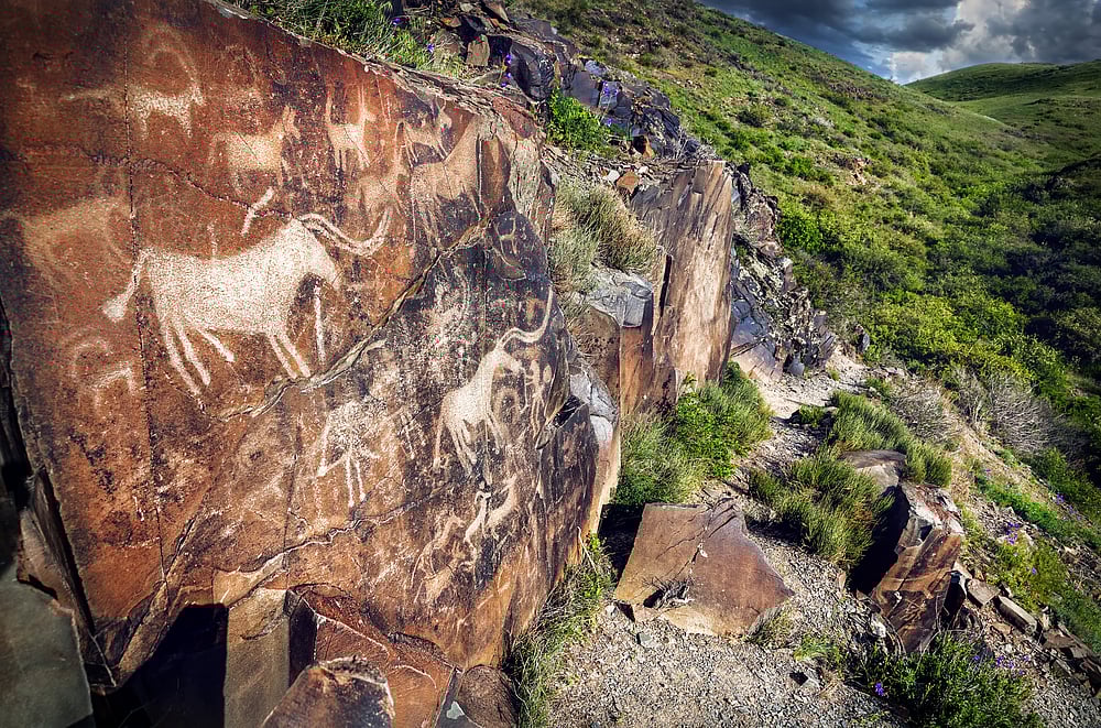 Ancient petroglyphs on mountains in Tamgaly-Tas
