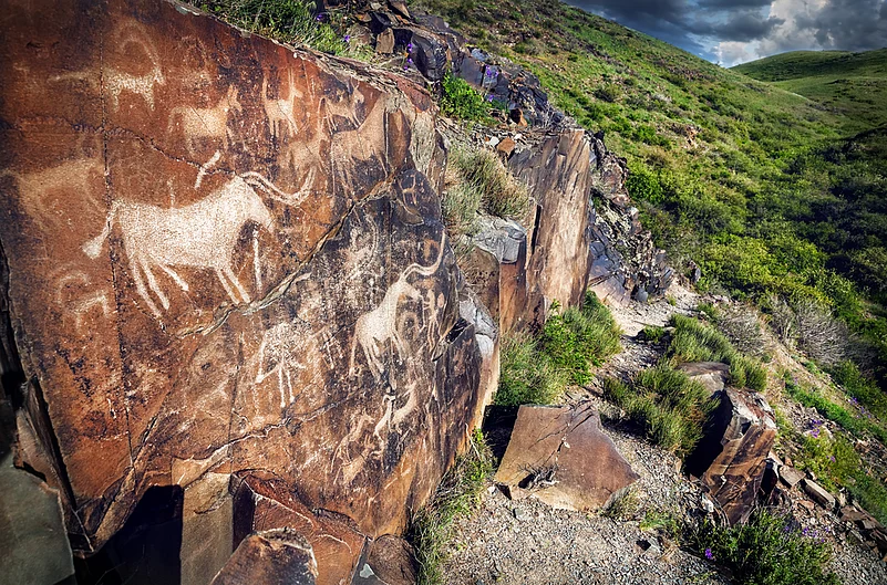 Ancient petroglyphs on mountains in Tamgaly-Tas