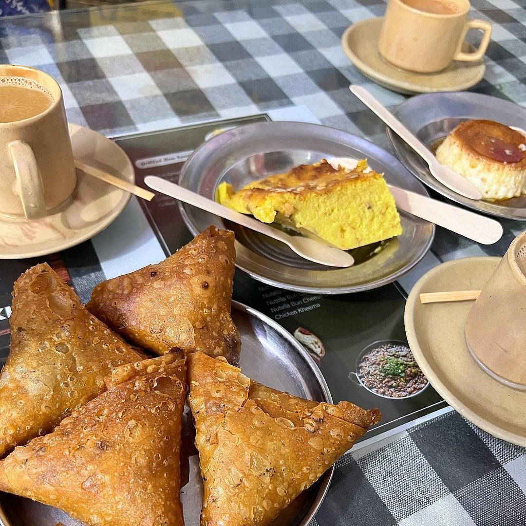 Tea with a side of samosas and puddings 