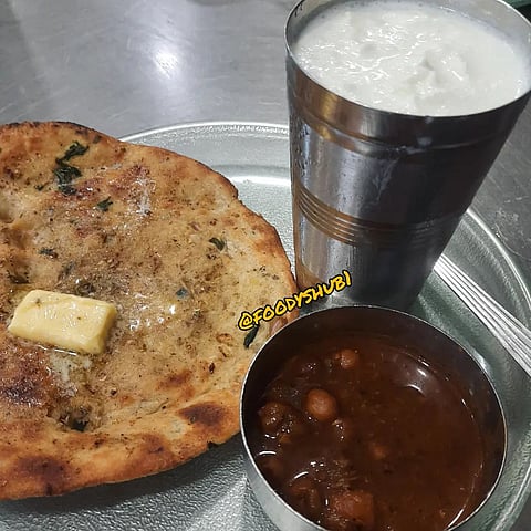 Crisp kulchas with a tall glass of yummy refreshing lassi