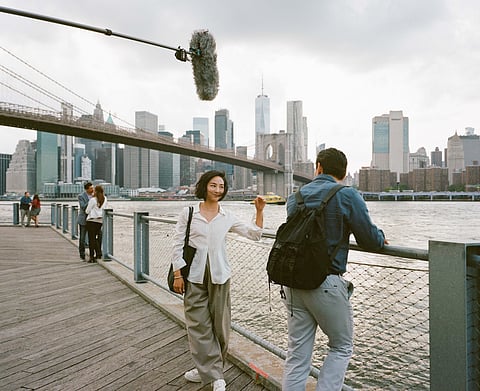 Nora and Hae Sung with the Brooklyn Bridge in background