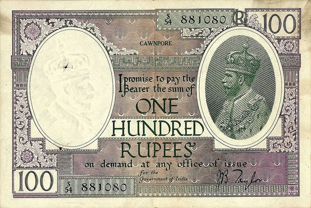 A hundred rupee note  issued during British rule