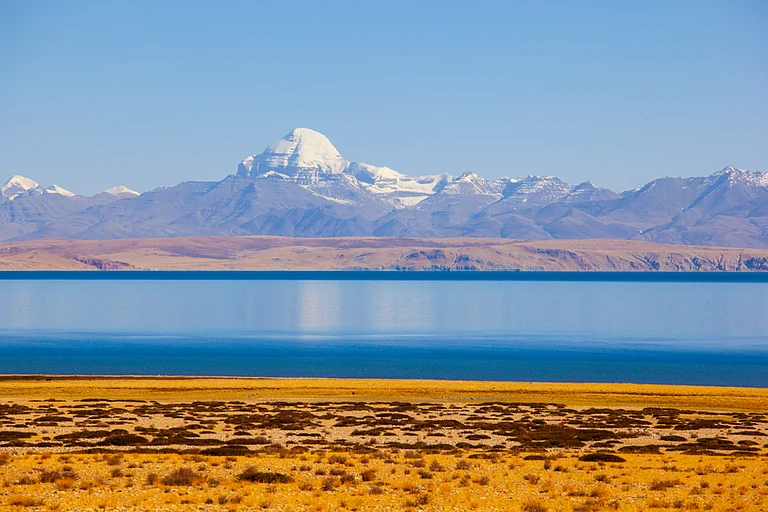 Lake Manasarovar with the Kangrinboqe Peak in the background - Meiqianbao/Shutterstock