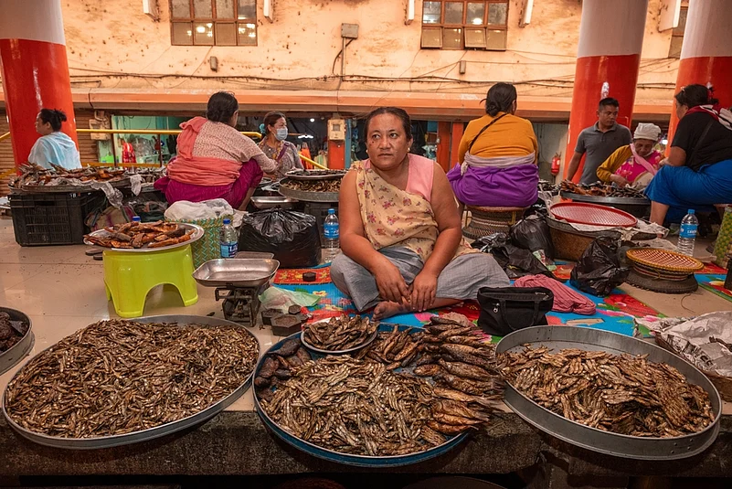 A woman selling dry fish at Ima Keithel market in Imphal