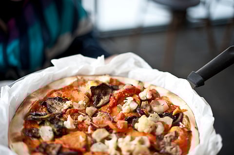 Vegan pizza being served in Tel Aviv