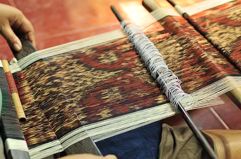 Ikat weaving in process