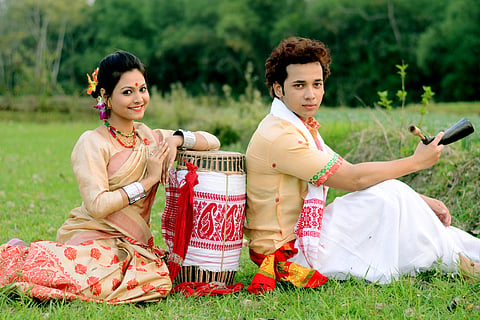 Man and woman in traditional attire on Bihu