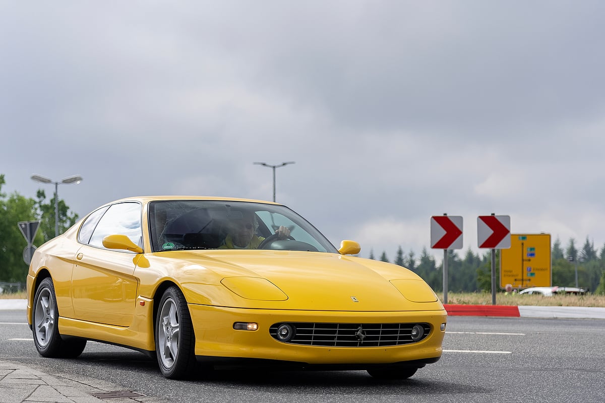 Yellow Ferrari 456M GT arriving at the Autobahn for an event