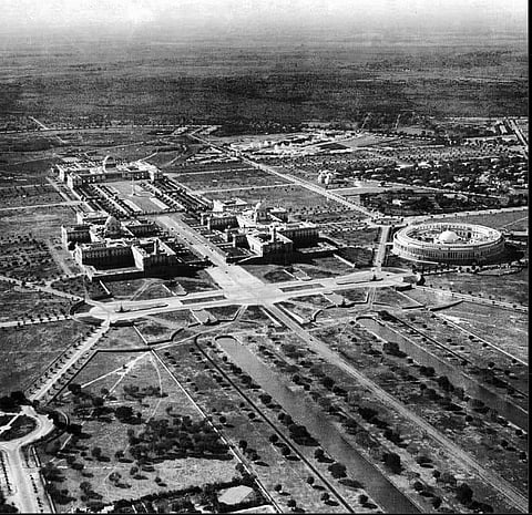 An aerial view of New Delhi, shot in 1930. We see the President's House at the top left, the North Block, the South Block, and the Parliament House on the right.