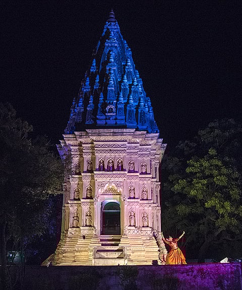 Geeta Chandran dancing against the backdrop of the unique Vedia Temple