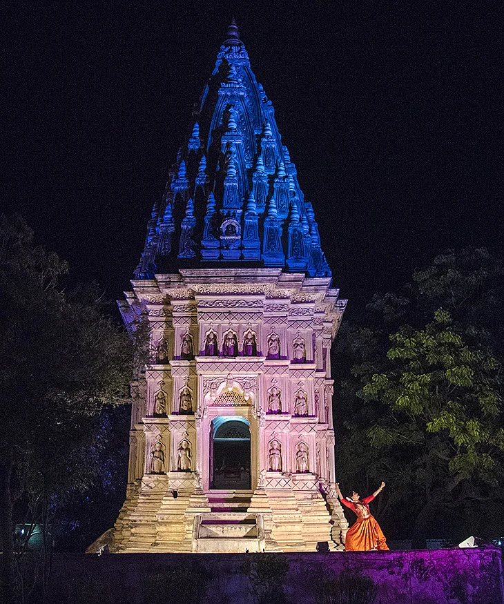 Geeta Chandran dancing against the backdrop of the unique Vedia Temple
