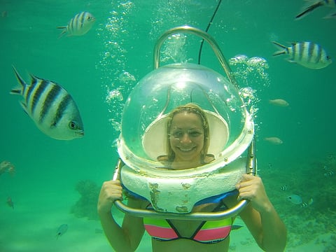 A participant in an undersea walk