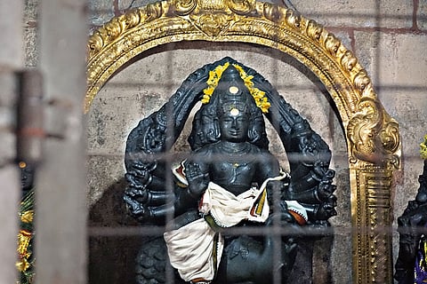 A black granite statue of Lord Karthikeya at the Thanjavur temple
