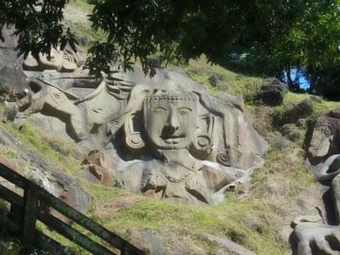 The huge vertical rock-cuts at Unakoti