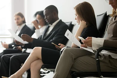Shutterstock : A group of candidates waits for a job interview