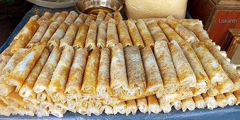 The wafer is made from a batter of rice flour, ghee, and water and cooked over an upturned pot