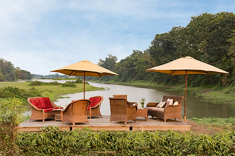 Riverside tea setup at Diphlu River Lodge