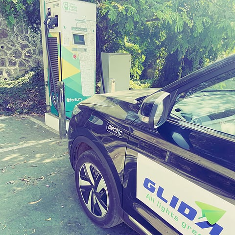 Sushil's EV at a charging station on the way