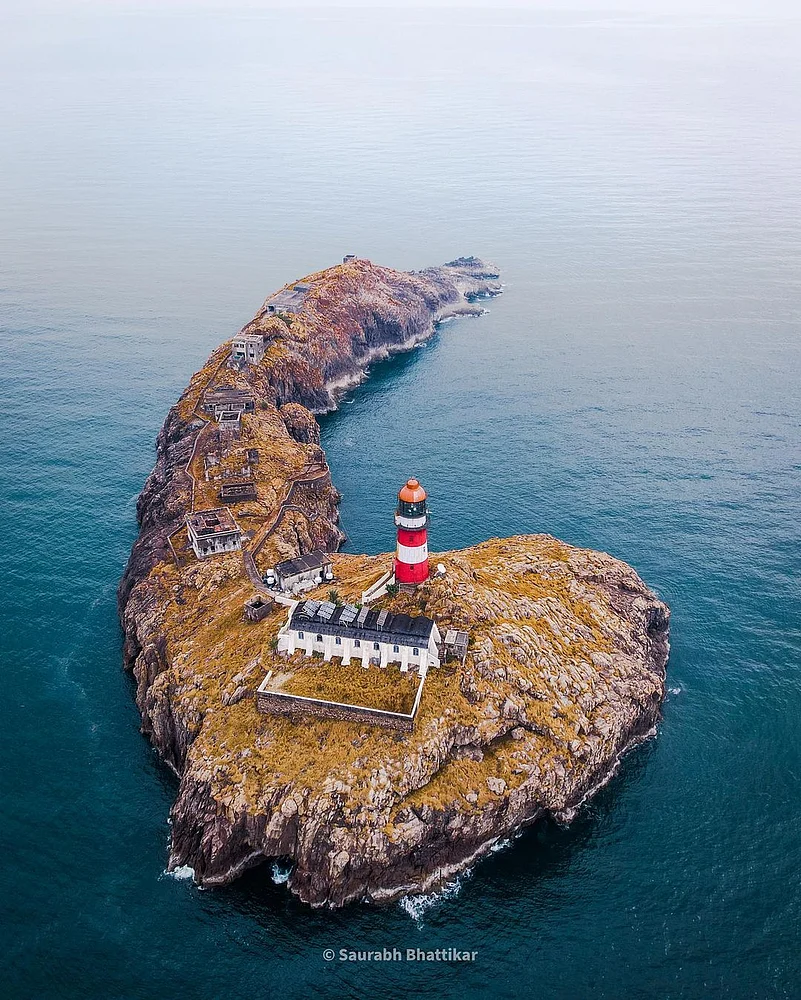 The Light Tower is entrenched on a granite base and sports a solitary coconut tree that has managed to take root among the stone