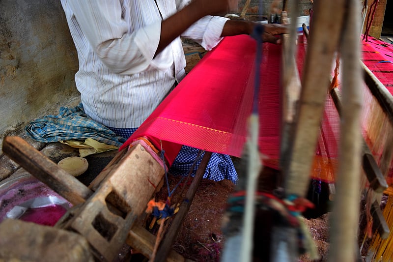 Weaver Koteswarao working on his handloom