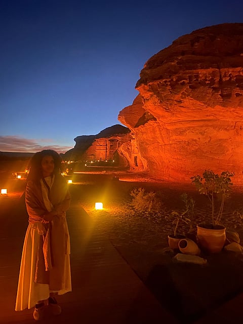 A woman dressed as a Nabataean welcomes us