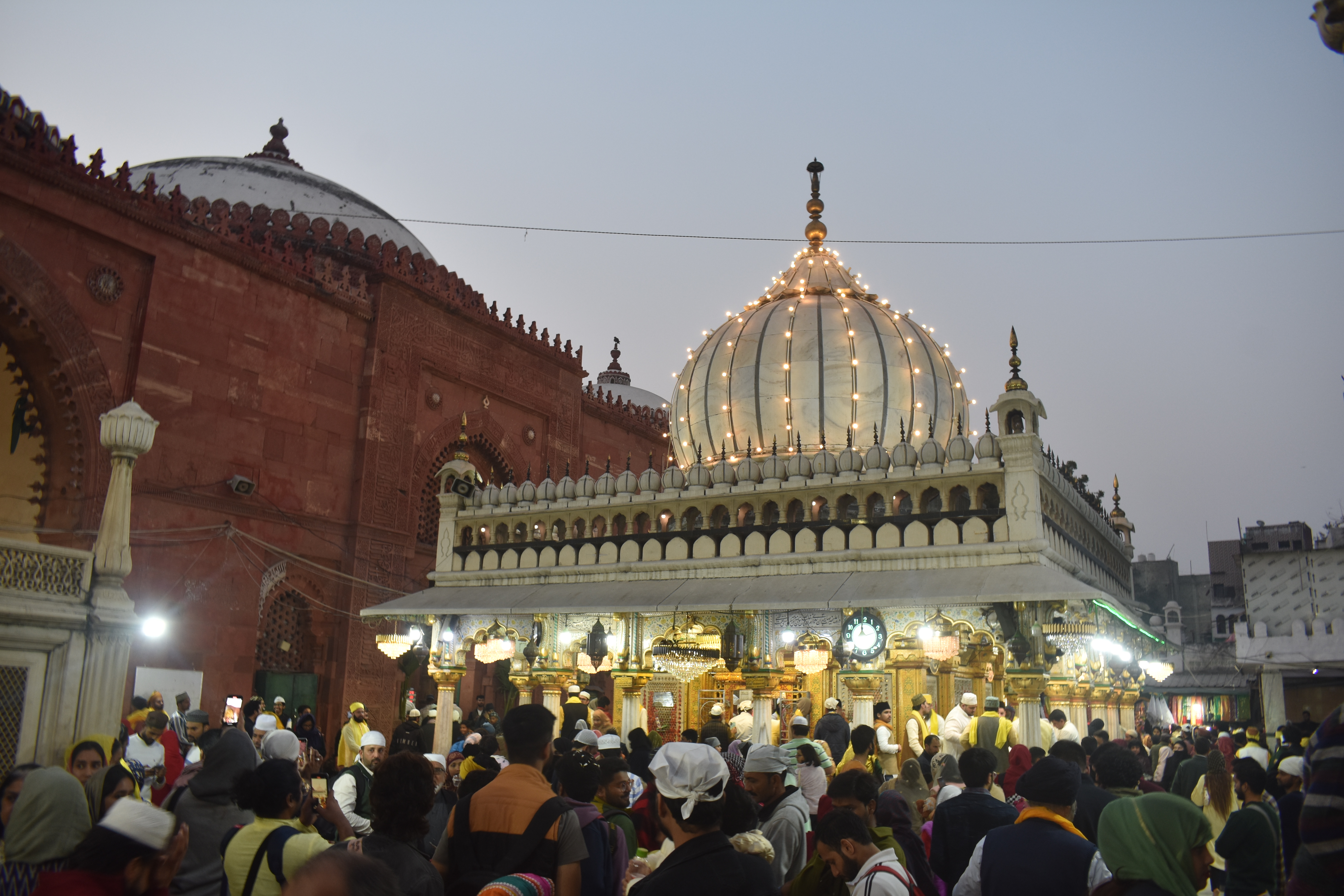 The dargah is lit up towards the end of the day