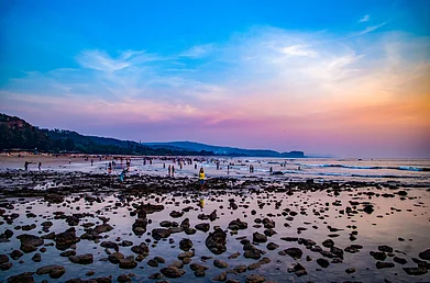 Shutterstock : People enjoying the sunset at Kashid Beach, Maharashtra, India