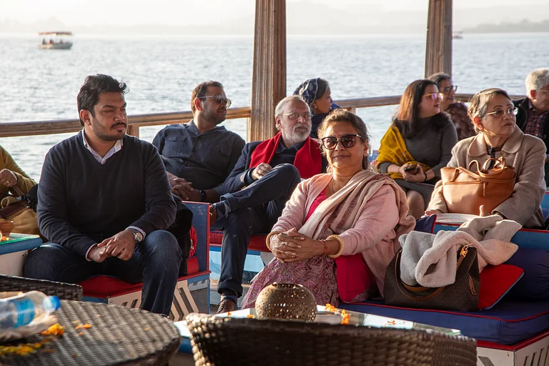 Sushmita Singha (center) sits at the Udaipur Tales 2024 event - Q
