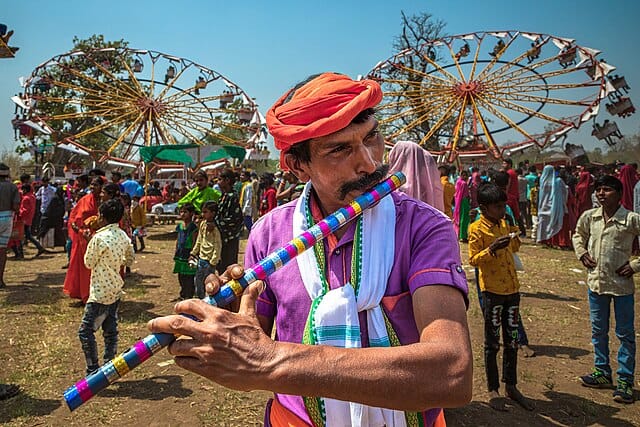 A Bhil tribesman playing the fute during the Bhagoria Festival celebrations in Madhya Pradesh
