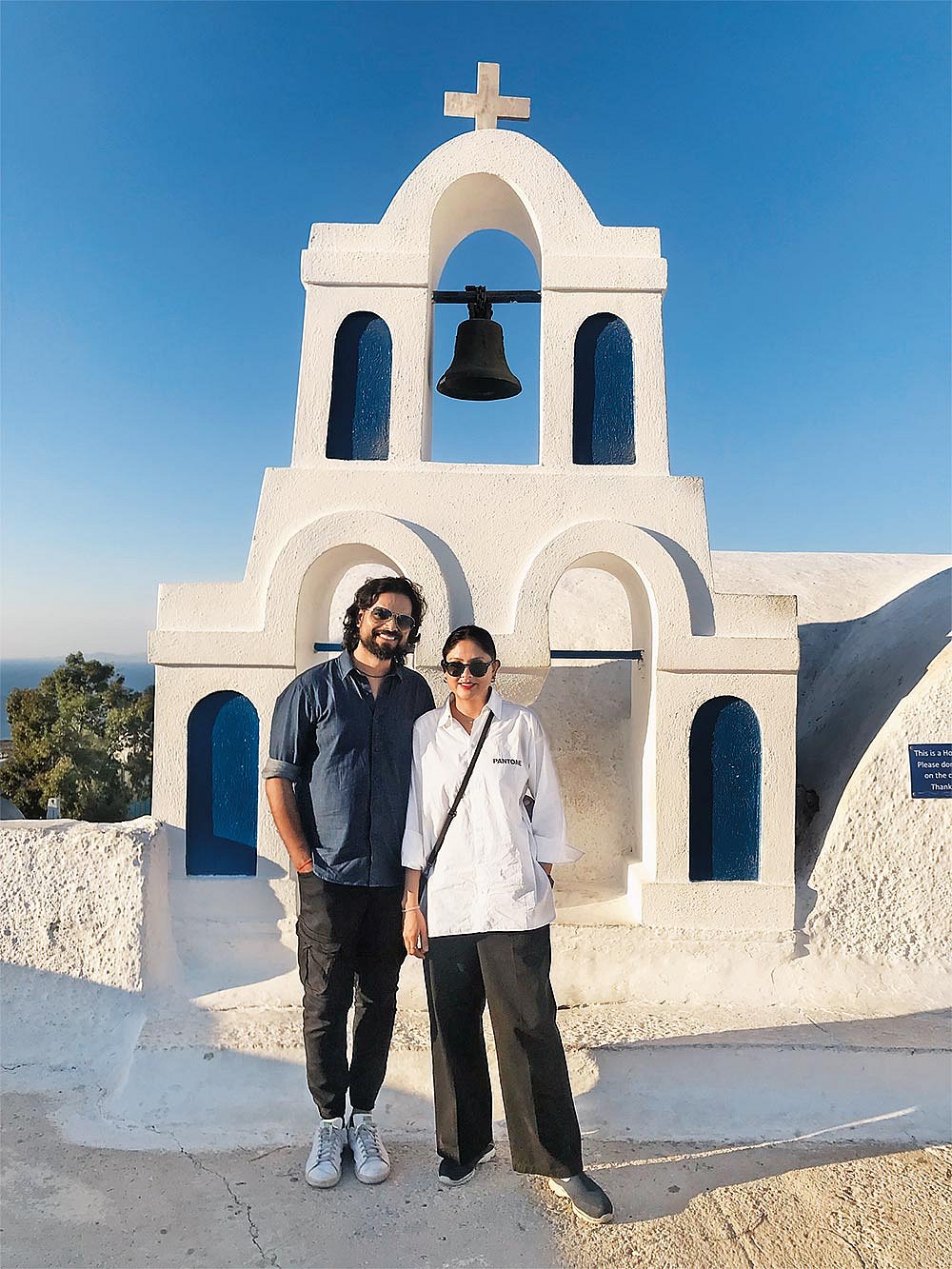 The designer and his wife, Divya, on vacation in Greece