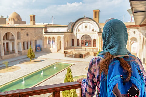 A tourist stands at the Tabatabaei Historical House