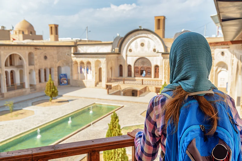 A tourist stands at the Tabatabaei Historical House