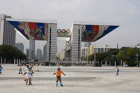 Children rollerblade at Seoul's Olympic Park