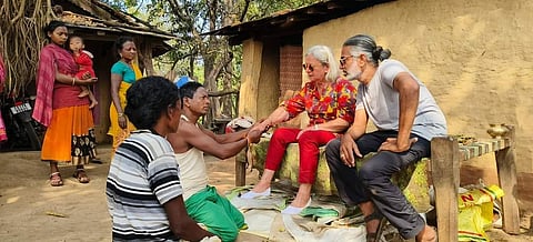 A guest (centre) with people from the local tribes (left) and Shakeel Rizvi (right)