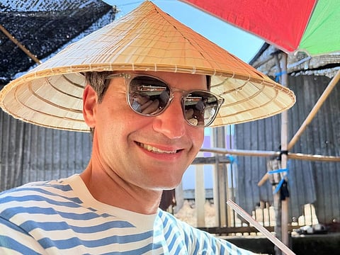 Federer sporting a bamboo hat in Thailand
