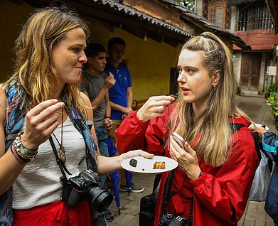 Copyright: Soul Travelling : Visitors eating Goan delicacies as part of the Secret Food and Tavern Trail in Panaji