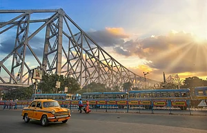 Roop_Dey/Shutterstock : Howrah Bridge and yellow taxis are among the iconic images of Kolkata