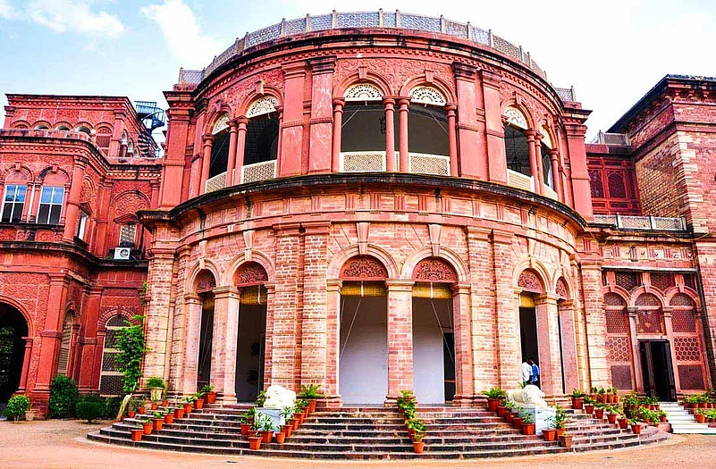 Intricate arabesques and jaalis cover the façade of the palace