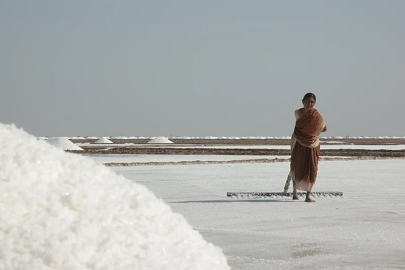 A woman working at a salt pan