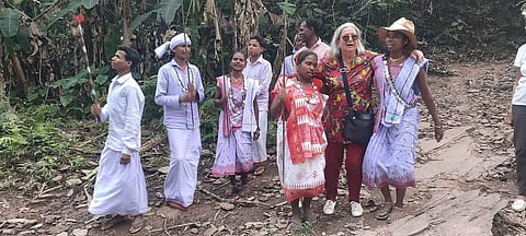 A guest mingles with people from the local tribes