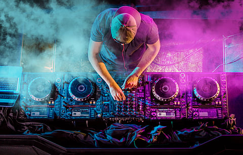 A view of DJ playing electronic music