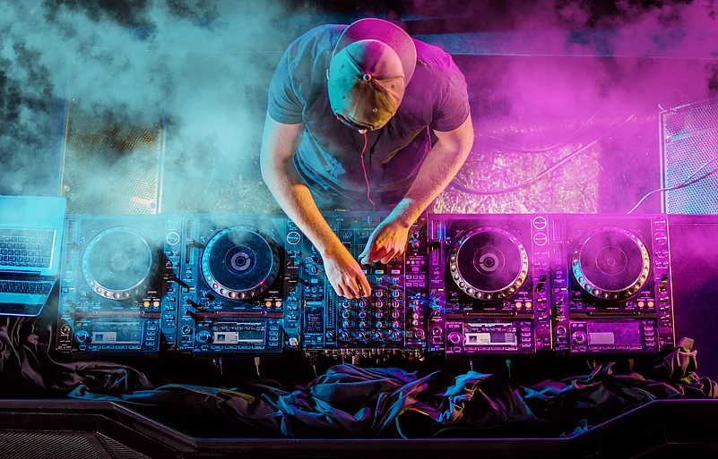 A view of DJ playing electronic music