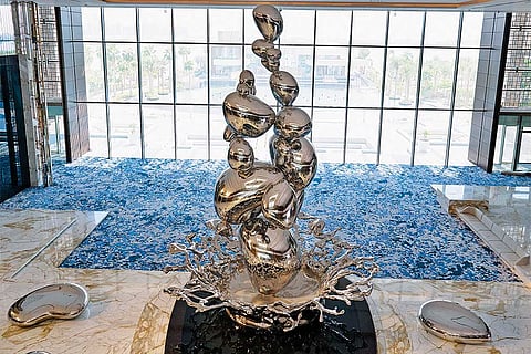 "Droplets," an 11.5-metre tall stainless steel centrepiece that mimics the splatter of raindrops on the desert greets you in the lobby