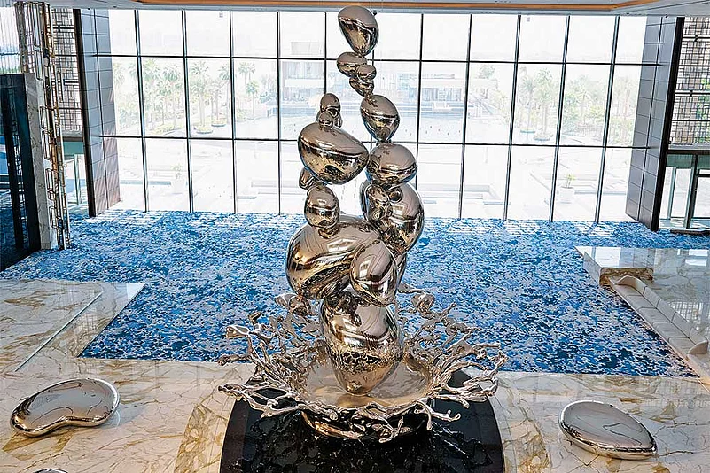 Droplets, an 11.5-metre tall stainless steel centrepiece that mimics the splatter of raindrops on the desert greets you in the lobby